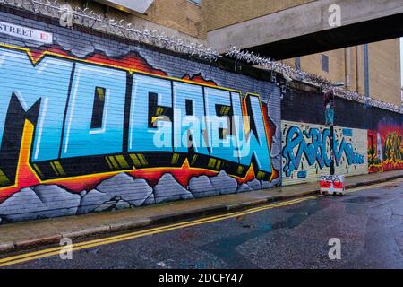 Vibrant, colourful, artistic graffiti on the walls at Grey Eagle St, Shoreditch, East London Stock Photo