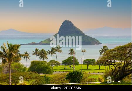 Mokoli'i Island (previously known as the outdated term 'Chinaman's Hat') island, distinctive small cone shaped island of the east coast of Oahu, Hawaii Stock Photo