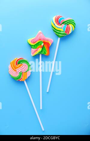 Top view of colorful lollipop on blue background, Stock Photo