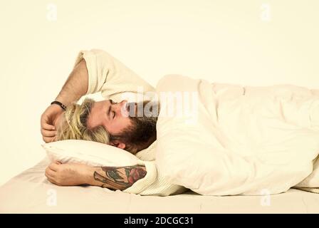 Practice relaxing bedtime ritual. Man with sleepy face lay on pillow. Fast asleep concept. Man with beard relaxing. Hipster with beard fall asleep. Having nap. Sweet dreams. Good night. Mental health. Stock Photo