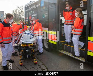 21 November 2020, Baden-Wuerttemberg, Ulm: Paramedics practice handling respiratory patients for the intensive care transport bus at the exhibition centre. The German Red Cross rehearsed the procedure for the vaccination of a corona vaccine in the vaccination centre planned for the state of Baden-Württemberg, among others. In Ulm, up to 120 people per hour will be able to be vaccinated. Photo: Stefan Puchner/dpa Stock Photo