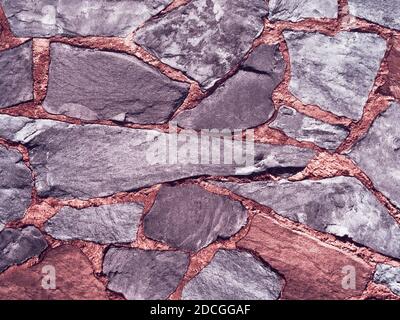 Cracked Real Stone Wall Surface With Cement Stock Photo