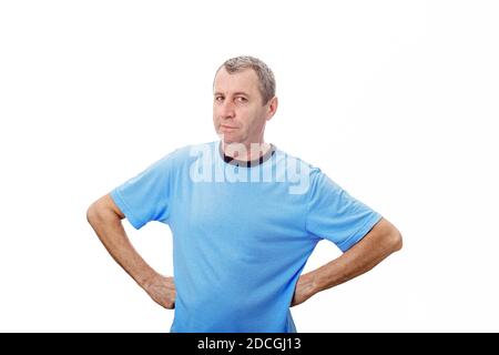 Middle age man feeling grumpy over white background. Portrait of irriated middle age man looking very displeased isolated on white background. Negativ Stock Photo