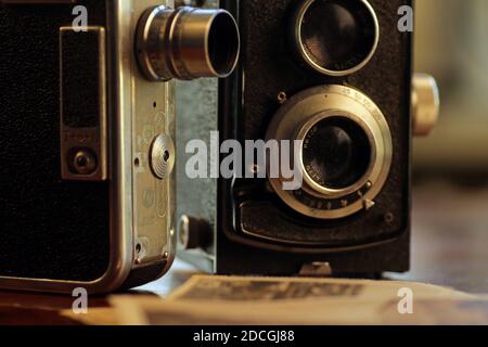 Old, vintage TLR camera - twin lens reflex and vintage movie camera Stock Photo