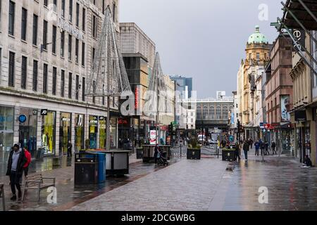 Glasgow, Scotland, UK. 21 November 2020. Views of Saturday afternoon in Glasgow city centre on first day of level 4 lockdown. Non essential shops and businesses have closed. And streets are very quiet. Pictured; Argyle Street is almost deserted   .Iain Masterton/Alamy Live News Stock Photo