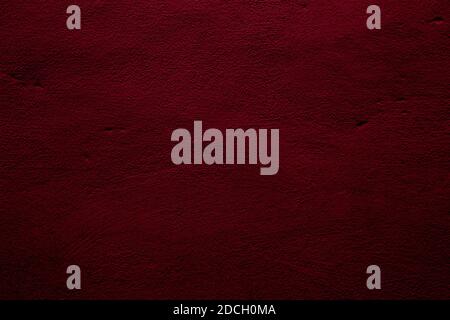 Crimson colored wall background with textures of different shades of red Stock Photo