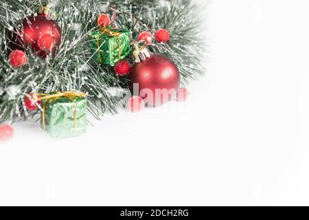 Red Christmas decorations with copy space on white background. Composition of Christmas holidays. Stock Photo