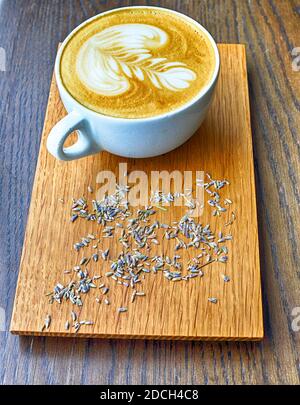 Lavender coffee cup. Latte art in cappuccino coffee cup at cafe table Stock  Photo - Alamy