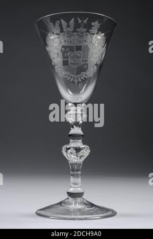 chalice, mid 18th century, General: 19.3 x 8.5cm 193 x 85mm, Base diameter: 8.2cm / Diameter chalice: 8.5cm, family crest, Colorless glass chalice. The chalice has an ascending base and a stem with a foot ring, baluster-shaped button with nine double air bubbles. Above a button and collar, in which a bubble ends in a point. An image of a coat of arms of the genus Gronsfeld Diepenbroeck, surrounded by tarpaulins, has been drilled on the chalice wall. The coat of arms can be described in colors, given the hatchings. Quartered, top left and bottom right in gold, with three red balls, top right Stock Photo