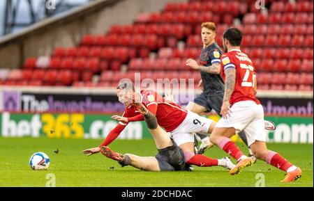 Oakwell Stadium, Barnsley, Yorkshire, UK. 21st Nov, 2020. English Football League Championship Football, Barnsley FC versus Nottingham Forest; Cauley Woodrow of Barnsley is upended Credit: Action Plus Sports/Alamy Live News Stock Photo