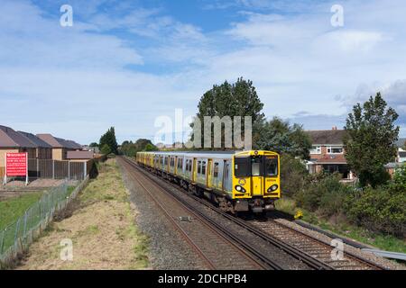 Merseyrail Electrics class 508+ 507  third rail electric trains 507014 + 508122 passing Formby  on the Merseyrail Northern line Stock Photo