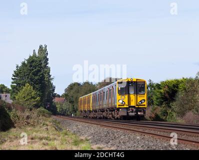 Merseyrail Electrics class 508  third rail electric trains 508130 + 508125  passing Formby  on the Merseyrail Northern line Stock Photo