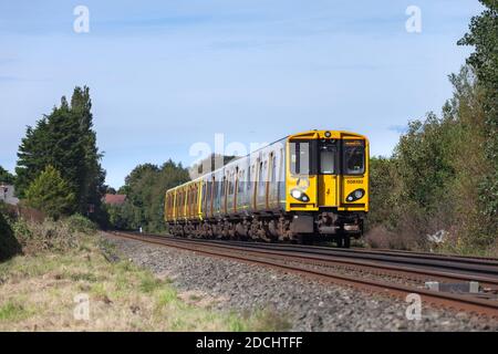 Merseyrail Electrics class 508  third rail electric trains 508130 + 508125  passing Formby  on the Merseyrail Northern line Stock Photo