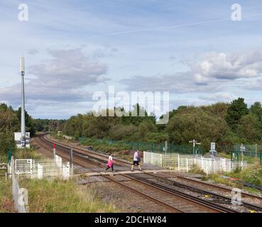 Freshfield railway level crossing with pedestrians using the level crossing Stock Photo
