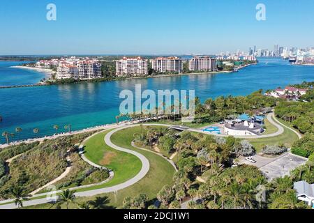 Aerial view of South Pointe Park and Fisher Island, Florida devoid of people under coronavirus pandemic beach and park closure. Stock Photo