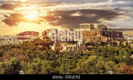 Acropolis of Athens at sunset, Greece. It is top landmark in Athens. Scenic sunny view of classical Greek ruins in summer, panorama of remains of famo Stock Photo