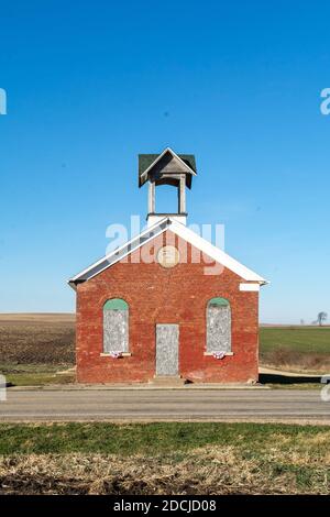 Old one room schoolhouse with farm fields behind.  German Valley, Illinois. Stock Photo