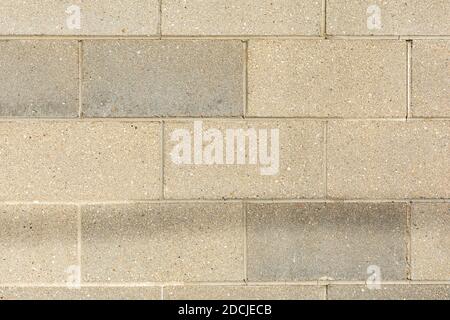 Old weathered concrete block/cinder block wall background/texture. Stock Photo