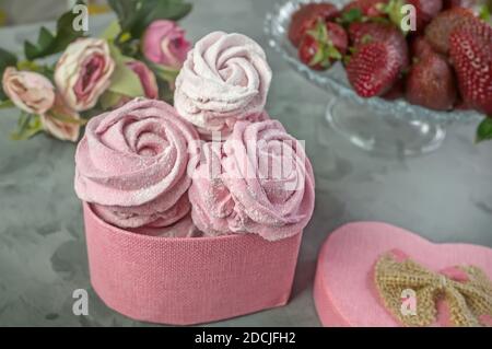 fresh handmade strawberry marshmallows in a light mood. Close-up of a pink marshmallow in a gift box. Gifts made with your own hands. Stock Photo