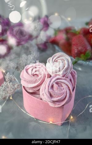 fresh handmade strawberry marshmallows in a light mood. Close-up of a pink marshmallow in a gift box. Gifts made with your own hands. Stock Photo