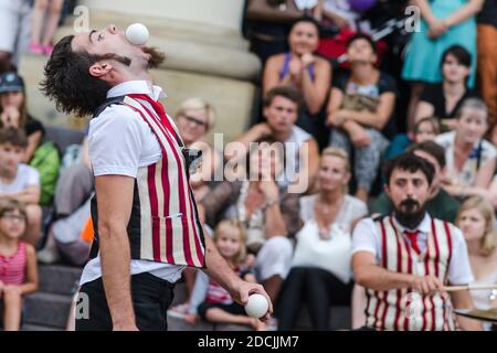 Lublin, Poland - July 25, 2014: La Sbrindola member with ball in mouth during performance at new circus and busking festival Carnaval Sztukmistrzow Stock Photo