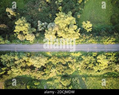 Eagle eye view of old railroad in the middle of the rural landscape on the outskirts of Zagreb city photographed with drone from above Stock Photo