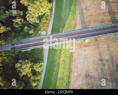 Railway bridge crossing Sava river on the outskirts of Zagreb city around rural landscape,, photographed from above Stock Photo