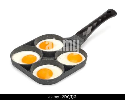 Frying pan with scrambled eggs top view. Isolated on white Stock Photo