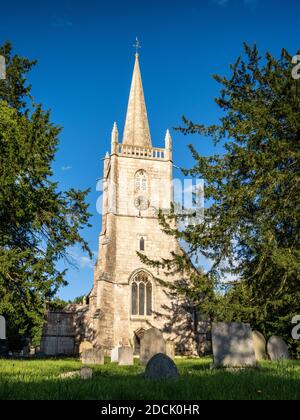 Sun shines on the traditional gothic tower of St Cyr's parish church in Stinchcombe, Gloucestershire. Stock Photo