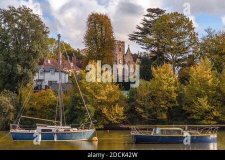 Autumnal scene with boats moored at Bartley Water in Totton and Eling during autumn 2020, Southampton, Hampshire, England, UK Stock Photo