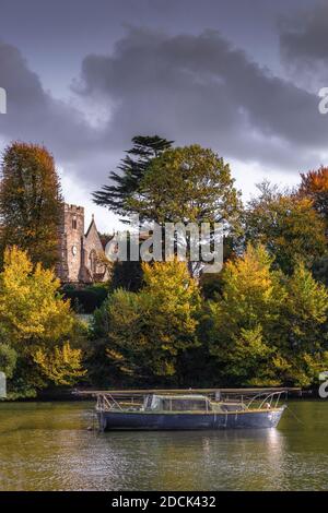 Autumnal scene with boats moored at Bartley Water in Totton and Eling during autumn 2020, Southampton, Hampshire, England, UK Stock Photo