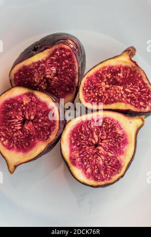 figs. Collection of whole and sliced fresh fig fruits. Fig chunks on white background Stock Photo