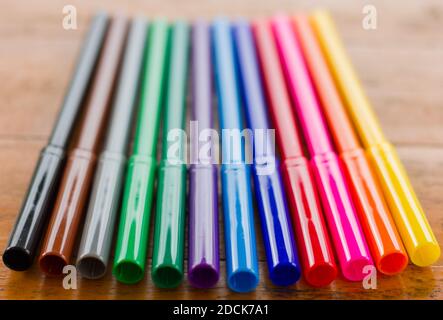 Close up on twelve color pens lined up ready to be used. Colorful drawing selection Stock Photo