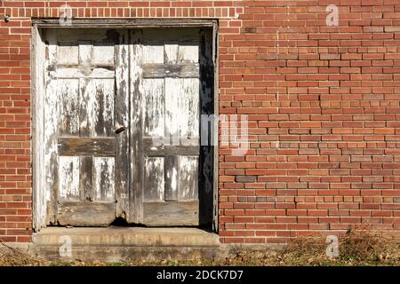 Old abandoned warehouse wall in natural light. Stock Photo