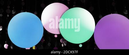 colorful blue pink green purple pastel lamp light party in the dark night banner background Stock Photo