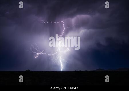 Strong storm and lightning bolt in the night sky over Arizona Stock Photo