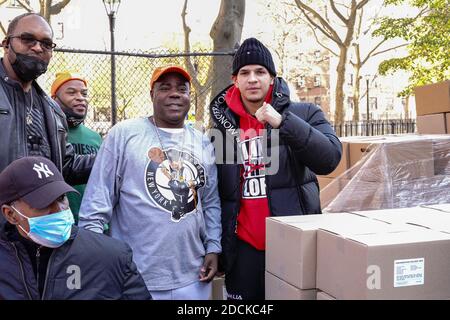 New York, United States. 21st Nov, 2020. Tracy Morgan (L), Edward Barlanga, Food Bank For New York City, and Council Member Robert E. Cornegy Jr. distribute turkeys to Brooklyn families during the Thanksgiving celebration. Credit: SOPA Images Limited/Alamy Live News Stock Photo