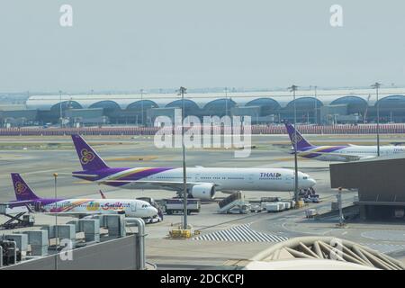 Bangkok, Thailand - March 10, 2020: Airplanes from Thai Airways are parked at their hub at the passenger gate connect to the gate inside Stock Photo