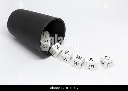 Dice cup with dice with letters and rhombus as joker, lettering News, symbolic image for news, news, Germany Stock Photo
