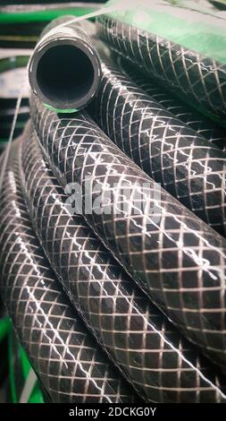 Close-up black and green garden water hose Stock Photo