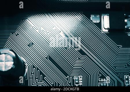Blue electronic mother board circuit close up macro background. Stock Photo