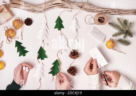 DIY Christmas home decor from natural materials. Elements for making  garlands paper, cones, twine Stock Photo - Alamy