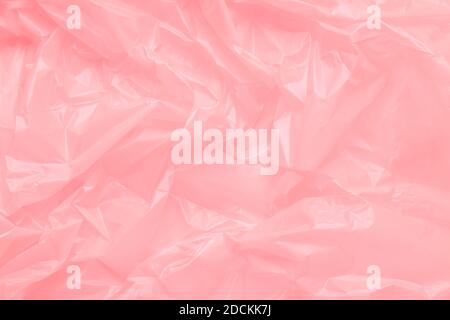Close up Texture of a Pink Plastic garbage Bag. Pink Polyethylene Film Stock Photo