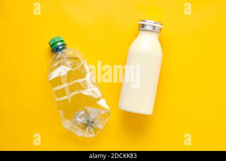 Metallic thermo Bottle and Plastic water Bottle. Concept of Ecology and stop Plastic pollution Stock Photo