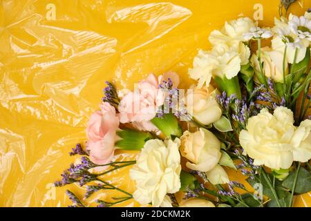 Flowers under a transparent film. Polyethylene Film Stock Photo