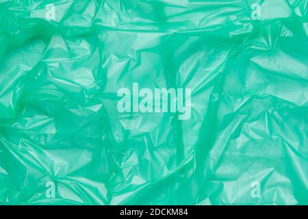 Close up Texture of a Green Plastic garbage Bag. Green Polyethylene Film Stock Photo