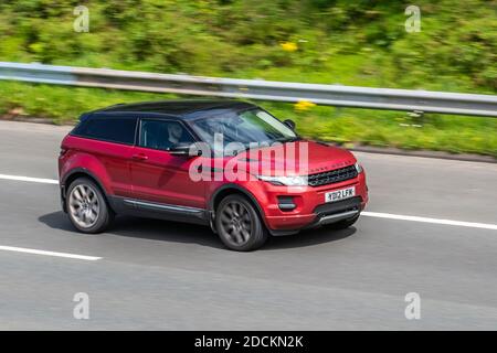 Red range rover car British smart sporty car Stock Photo - Alamy