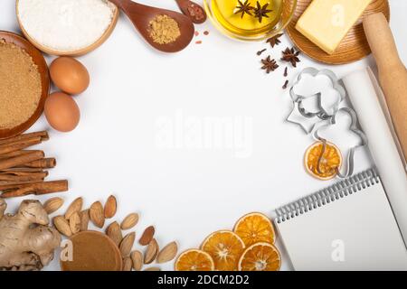 Christmas food background frame.Culinary background for a Christmas baking  recipe, cookie molds, ingredients, spices, top view, flat lay, copy space  Stock Photo