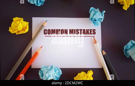 Conceptual hand writing text caption inspiration showing Common Mistakes. Business concept for Common Decision Mistakes written ower white paper, with Stock Photo