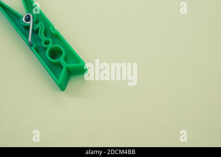 A top view of plastic clothespin isolated on a light surface Stock Photo